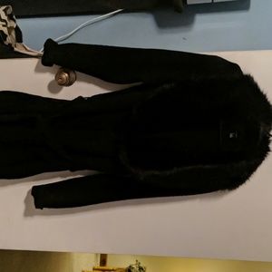 Black knit sweater with attached faux fur collar.